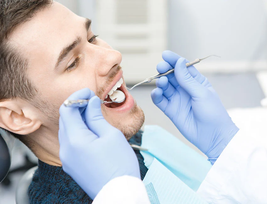 Dentist checking patients dental fillings
