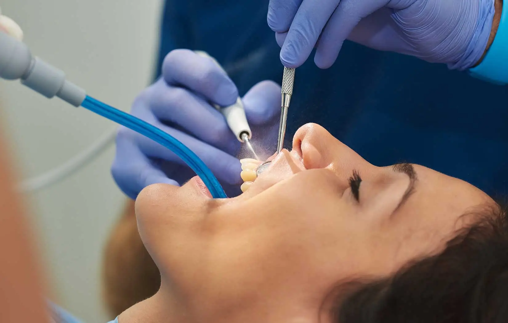 Periodontist checking patients gum health