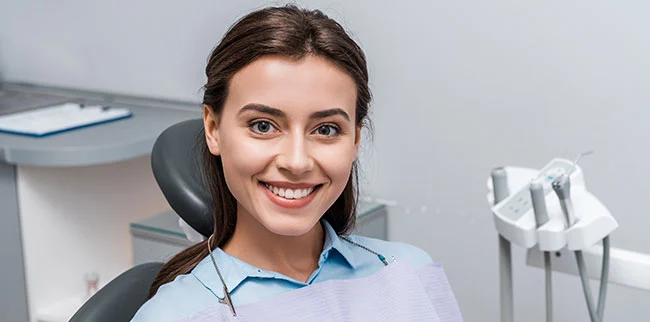 New patient smiling in La Jolla Dental office